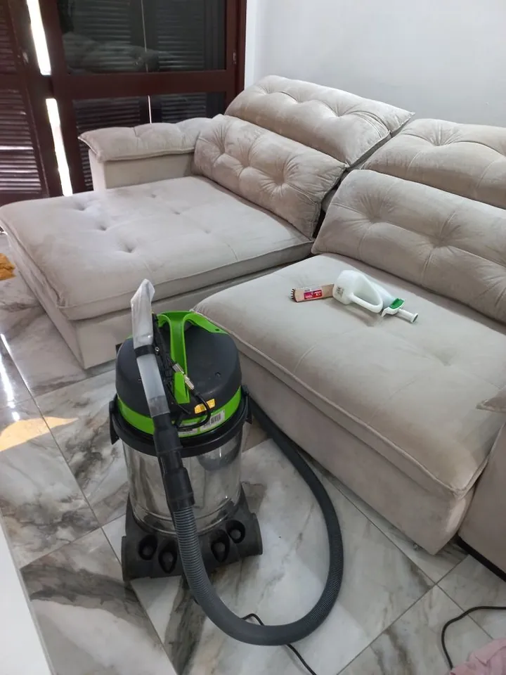 Sectional sofa being deep cleaned with a professional extractor machine